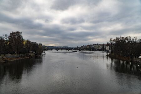 View of Prague from the bridge, Prague bridges on moldava with trafficの写真素材