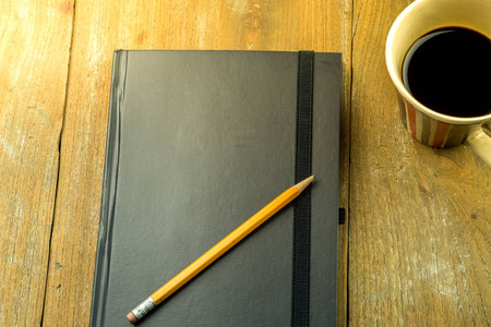 Topview shot of notepad on deskの写真素材