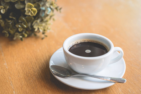 Coffee white cup , Black coffee on wood table ,warm and good smellの写真素材