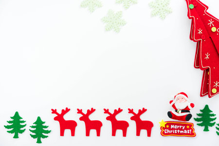 Christmas composition. Christmas tree, dear, Santa Claus on white background. Flat lay, top viewの写真素材