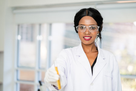 Scientist  in laboratory with holding a test tube. Medical healthcare technology and pharmaceutical research and development conceptの写真素材