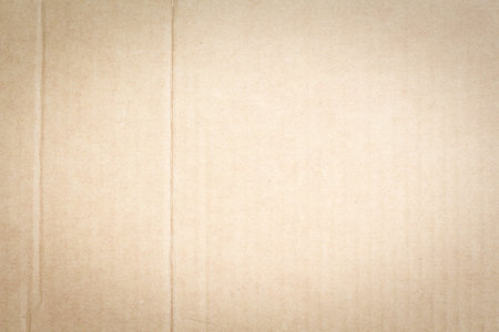 Paper texture light rough textured spotted blank copy space background in beige, yellow, brown