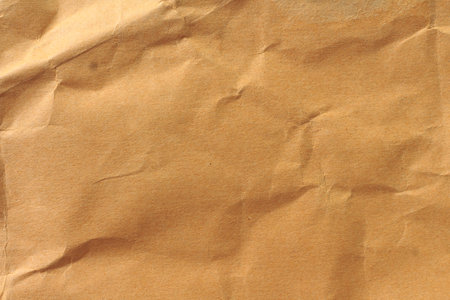 paper background texture light rough textured spotted blank copy space background in yellow,brownの写真素材