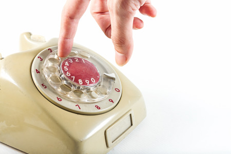 dialing up on a vintage telephoneの写真素材