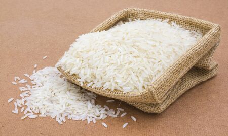 rice in small burlap sackの写真素材