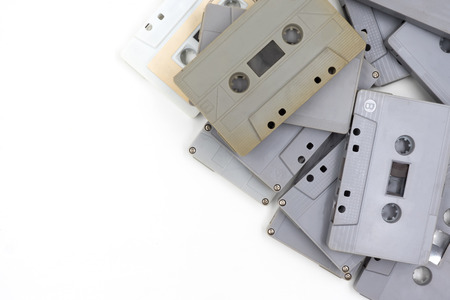 group of old cassette tapes on white background.の写真素材