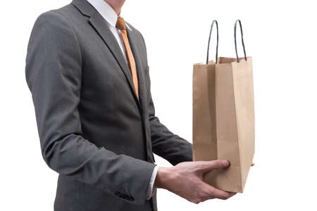 Businessman holding a shopping bag  isolated on white background.の写真素材