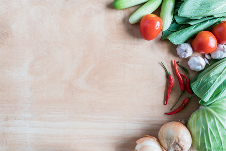 Top view of Fresh vegetables  on wooden table background.の写真素材