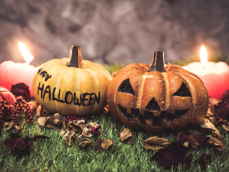 Halloween pumpkins with candlelight on dark background.の写真素材