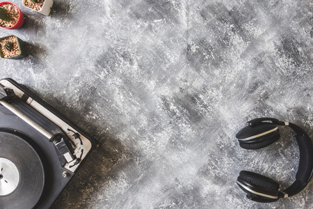 Top view of Vintage Turntable with headphone and cactus on grunge background, Free space for textの写真素材