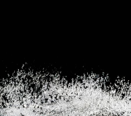 Bubbles water isolated on black backgroundの写真素材