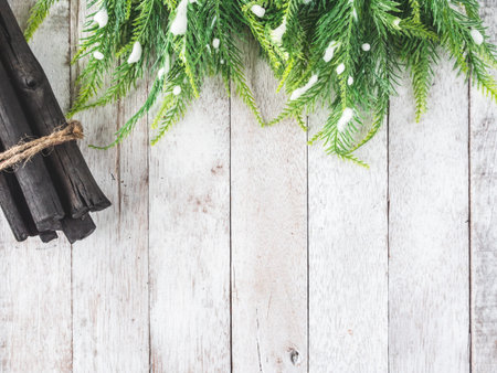 Top view of Fir tree with Firewood on wooden table, Christmas decoration background