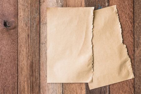 Top view of Blank brown paper on wooden table background.の写真素材