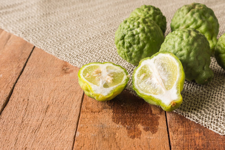 Close up of bergamot or kaffir lime on wooden table background.の写真素材
