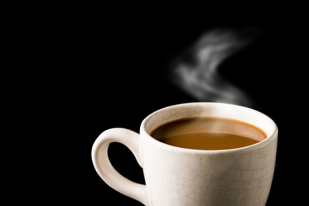 Cup of coffee on black background. Free space for textの写真素材