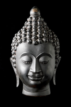 Buddha statue on black background.の写真素材