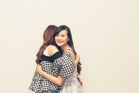 Two happy women hugging and smiling, Vintage toneの写真素材