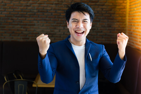 Successful young businessman with charming confident smile.の写真素材