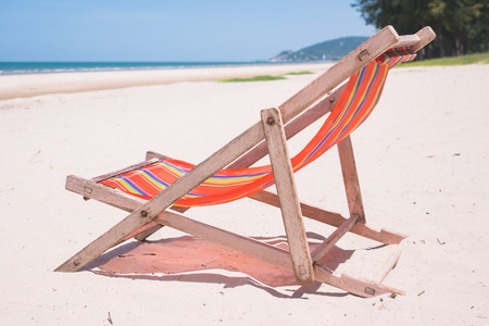 Red canvas chair on the beach.の写真素材