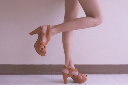 Close up of female lags with high heels shoes.の写真素材