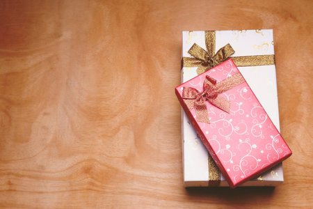 Top view of gift boxes on the wooden table. Free space for textの写真素材