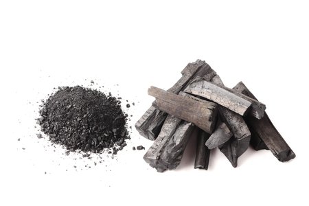 Charcoal and powder (activated carbon) on white background.の写真素材