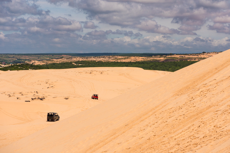 Yellow sand dunes in Mui Ne is a popular tourist destination of Vietnamの写真素材