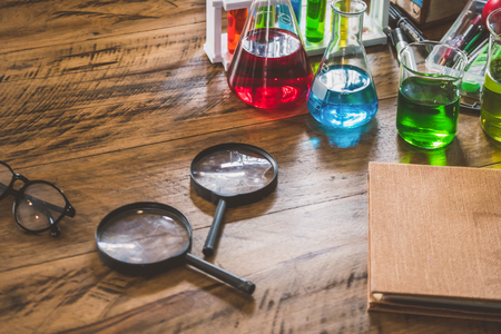 Chemistry equipment set on the wooden table.の写真素材