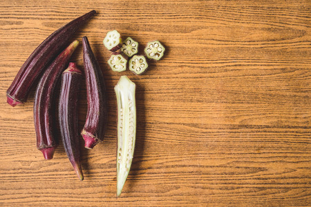 Fresh Red okra on wooden background.の写真素材