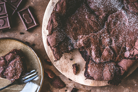 Top view of Chocolate cake on wooden tray with fork.の写真素材