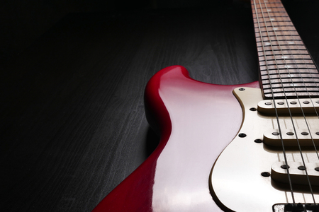 Close up of Electric guitar body and neck detail on black background.の写真素材