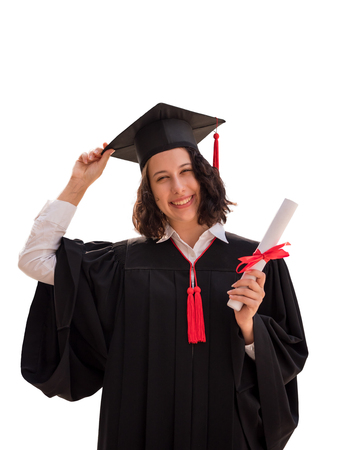 Portrait of Young woman with graduation cap and gown holding diploma isolated on white background, Successful conceptの写真素材