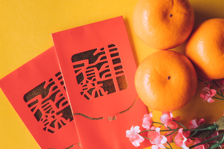 Top view of Chinese new year festival decorations on yellow background.の写真素材