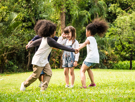 Group of children playing together in the parkの写真素材