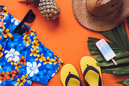 Top view of Summer accessories on orange backgroundの写真素材