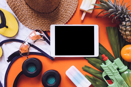 Top view of Summer accessories on orange backgroundの写真素材