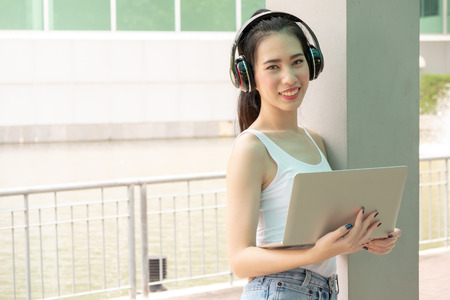 Portrait of Young asian student in university campusの写真素材
