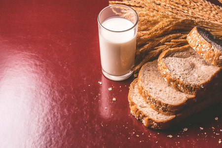 Healthy breakfast with whole wheat bread and milk on the table. copy spaceの写真素材