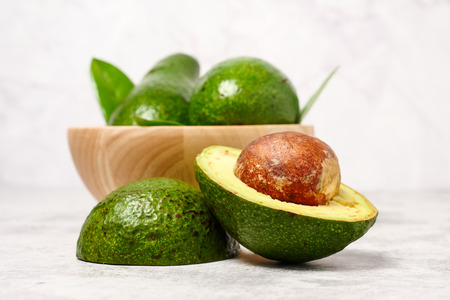 Close up of avocado on cement tableの写真素材