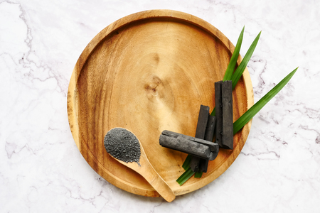 Bamboo charcoal and powder on marble table. copy spaceの写真素材