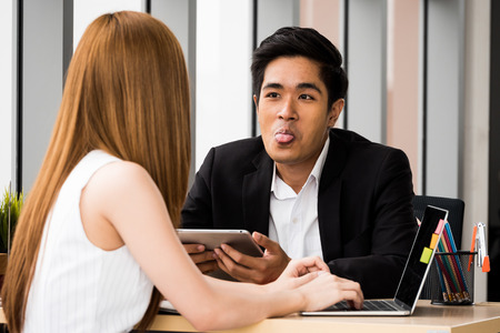 Asian Businesspeople are happy to work together at the office.の写真素材