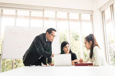 Asian Businesspeople are brainstorming while meeting together at the office.の写真素材