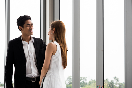 Asian Businesspeople are feeling happy together at the office.の写真素材