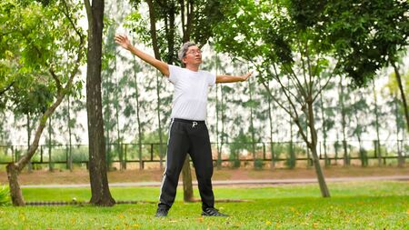 Asian man doing streching at the park.の写真素材