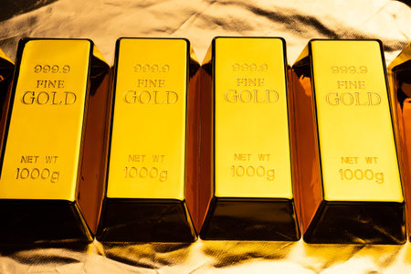 Gold bars on shiny yellow background.