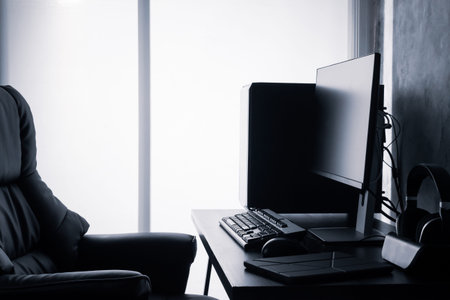 Black computer on the desk.