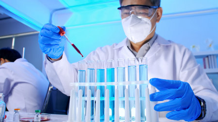 Group of Asian scientists doing some research in the laboratory.