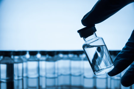 Group of Vaccine bottles. Medicine in ampoules. Glass vials for liquid samples in laboratory.の写真素材