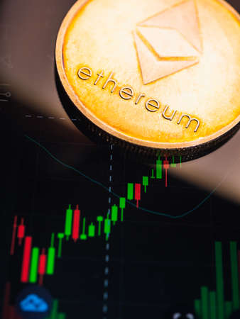 Ethereum coin with stock graph background. Digital currency concept.の写真素材