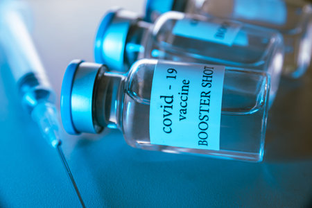 COVID-19 booster vaccine vials. Medicine and health care concept